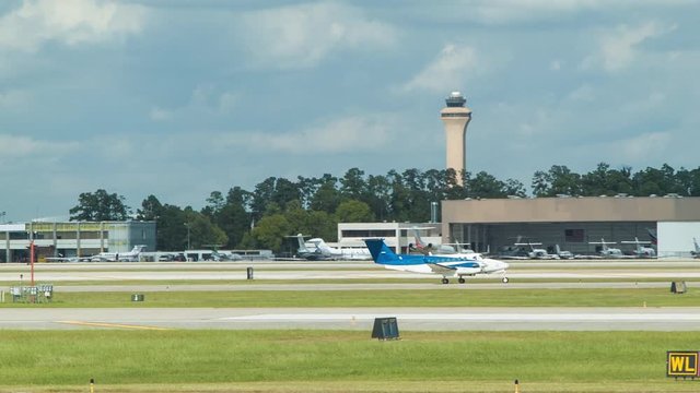 Unmarked Private Charter Turbo Prop Airplane on Taxiway at a Sunny George Bush Intercontinental Airport IAH in Houston TX