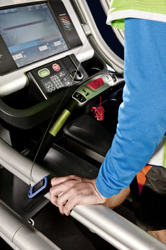 Close up of male arm and heart rate monitor on gym treadmill in altitude centre