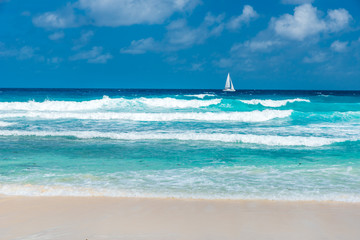 Sailing Boat at Tropical Grand Anse on island La Digue, Seychelles