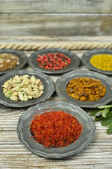  Spices and herbs in metal bowls. Food and cuisine ingredients.