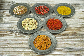 Spices and herbs in metal bowls. Food and cuisine ingredients.