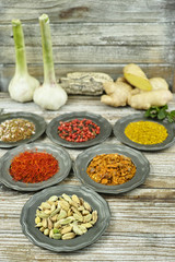 Spices and herbs in metal bowls. Food and cuisine ingredients.