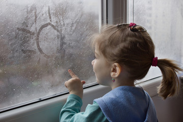 girl draws on glass