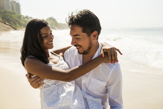 Romantic couple on Arpoador beach, Rio De Janeiro, Brazil