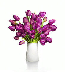 Bouquet of red tulips in white vase