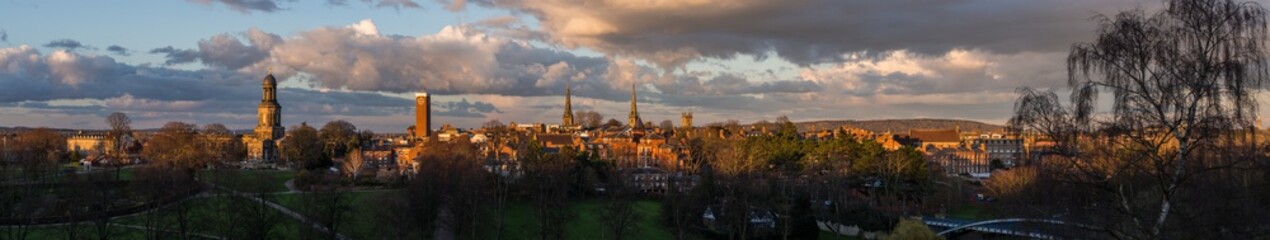 Shrewsbury panorama showing the church spires of St. Chad's, St. Mary's, St. Alkmund's and the cathedral, in golden evening light. © mfarr