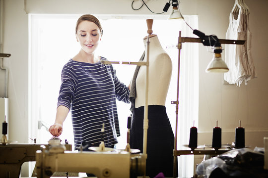 Seamstress Working At Tailors Dummy