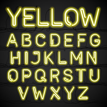Yellow neon light alphabet with cable