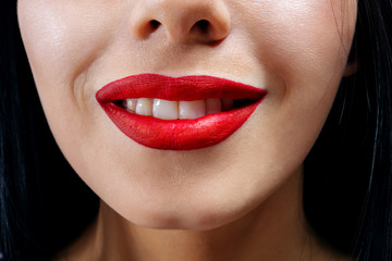 Fototapeta premium beautiful girl smiling. lips painted red lipstick 
