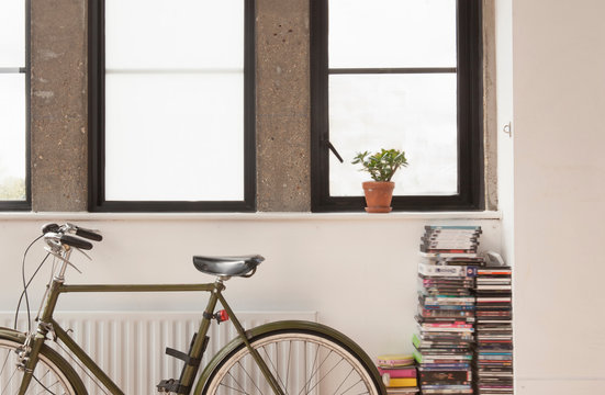 Apartment interior with bicycle and cd collection
