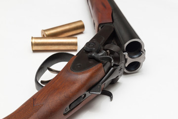 Part of gun with bullet in white background