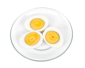 Boiled eggs on plate separated on white background