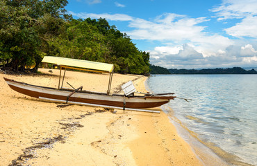 Fototapeta na wymiar Boat on Siuri beach at Poso lake. Indonesia