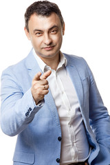 Portrait of middle aged man in blue jacket. Isolate on white. points finger.