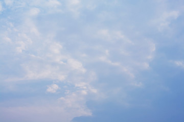 blue sky background with tiny purple clouds