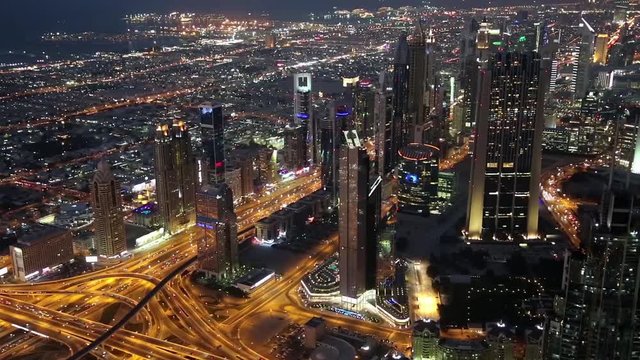 Dubai downtown at night, United Arab Emirates. View on Sheikh Zayed road from the 124th floor of Burj Khalifa skyscraper in Dubai, currently the tallest structure in the world, 829,8 m or 2,722 ft