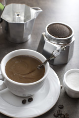 Italian coffee maker pot filled with coffee beans
