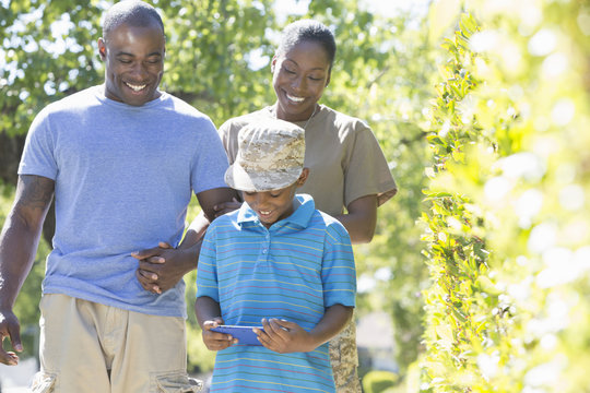 Female soldier strolling with family on homecoming