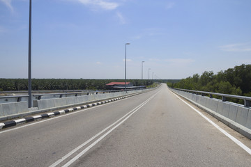 Fototapeta na wymiar Rural road highway for speed drive journey, empty freedom bridge route for motion trip