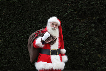 Santa Claus carrying sack over shoulder