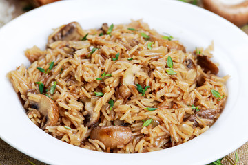 Risotto mushrooms with parmesan cheese, fresh herbs, rice, onion.
