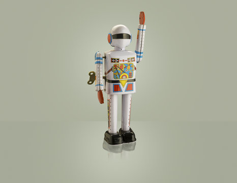 Studio shot of astronaut robot with arm raised