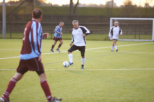 Football player with possession of ball