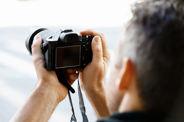 Male photographer taking picture