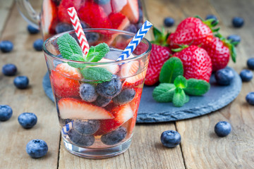 Refreshing cocktail with strawberry and blueberry