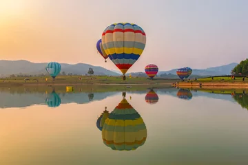 Foto op Canvas Hot air color balloon over lake with sunset time, Chiang Rai Province, Thailand © Southtownboy Studio