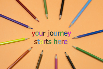 Colored Pen written showing to center with a word your journey starts here
