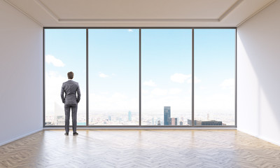 Fototapeta premium Businessman in empty office