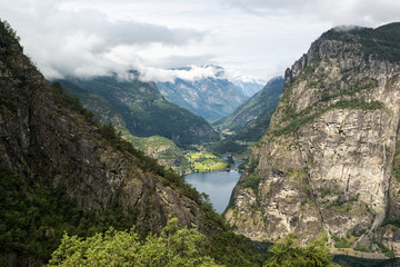 Fototapeta na wymiar Classic Norwegian view with mountains, trees and fjord, Norway