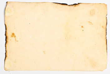 very old paper with burnt edges