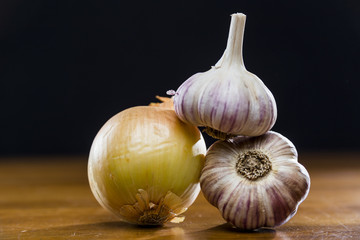 Onion Garlic and Ginger on Dark Background