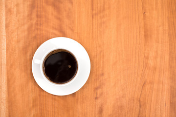 cup of coffee on wooden table