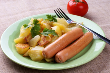 fried potatoes and sausages