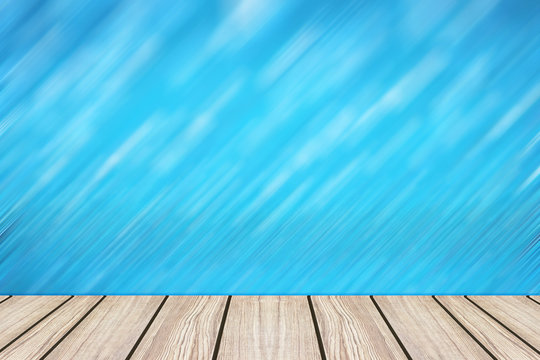 wood floor with blue motion blur wall for background