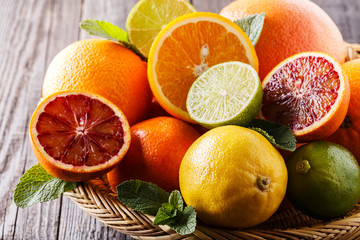 Assorted fresh citrus fruits.