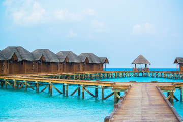 Over water bungalows with steps into amazing green lagoon 