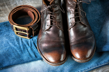 boots in cowboy style with jeans, belt and buckle