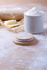 Dough recipe ingredients on wood table.