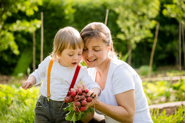 Mother and child gardening