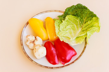 a vegetable dish consisting of cabbage,and red and yellow pepper