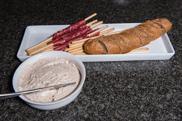 grissini with meat and bread with tuna creme
