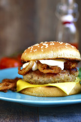 Burger with meat cutlet and caramelized onion.