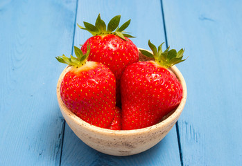 strawberries on a blue board
