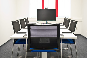 Team conference room with big table and board in the modern office