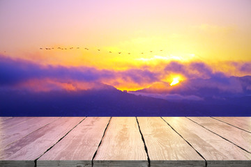 Empty table on sunset background
