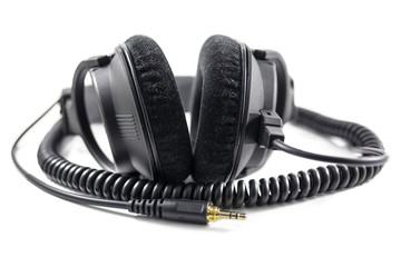 Black professional headphones isolated on white background